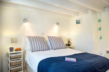The lovely double bed on the ground floor, where you can hear the sea (Bedroom 1).