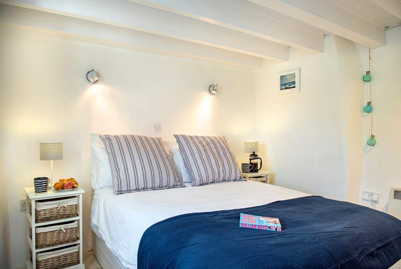 The lovely double bed on the ground floor, where you can hear the sea (Bedroom 1). 