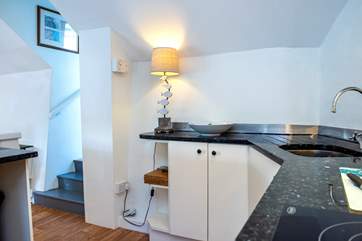 Three steps from the living space lead up to Bedroom 3 and the family bathroom.