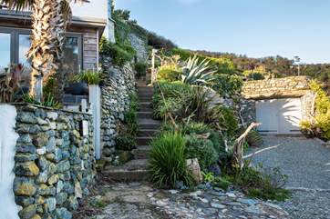 The steps from the beach leading up the coast path to Bank Cottage on the left.