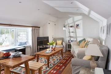 The open plan living space is full of colour.