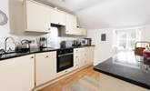 The kitchen is very well appointed and is open plan with the dining and lounge space. - Thumbnail Image