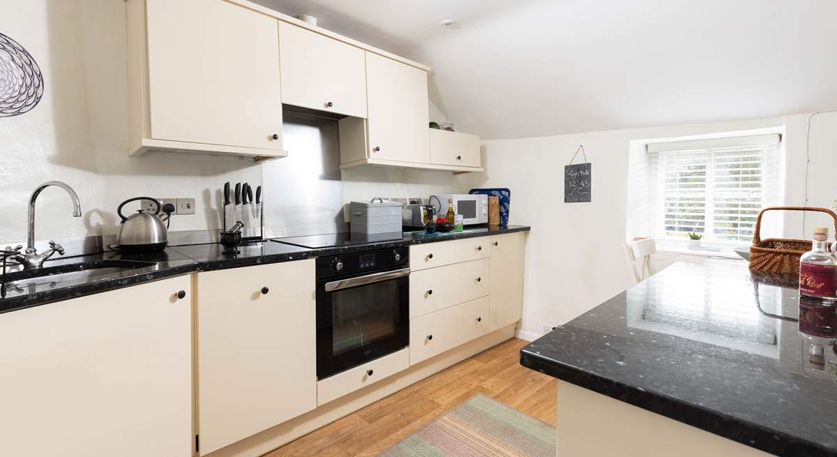 The kitchen is very well appointed and is open plan with the dining and lounge space.