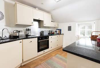 The kitchen is very well appointed and is open plan with the dining and lounge space.