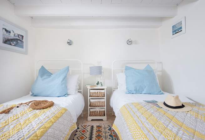 Drift off to the song of the sea in the ground floor twin bedroom.