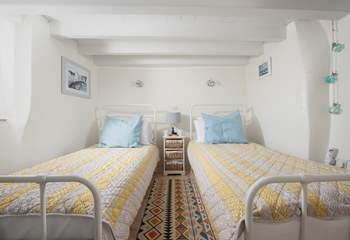 Drift off to the song of the sea in the ground floor twin bedroom.