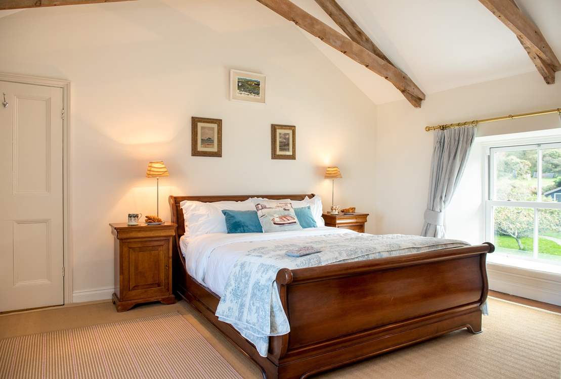 Bedroom 1 has a beautiful sleigh bed.