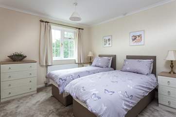 Pretty bedroom three over looks the gardens.