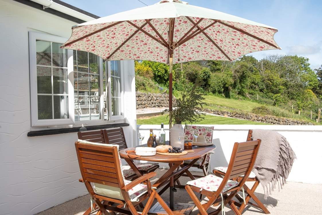 The terrace overlooks the pretty gardens.