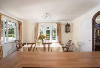 The dining-table overlooks the pretty front garden at Homeleigh. 