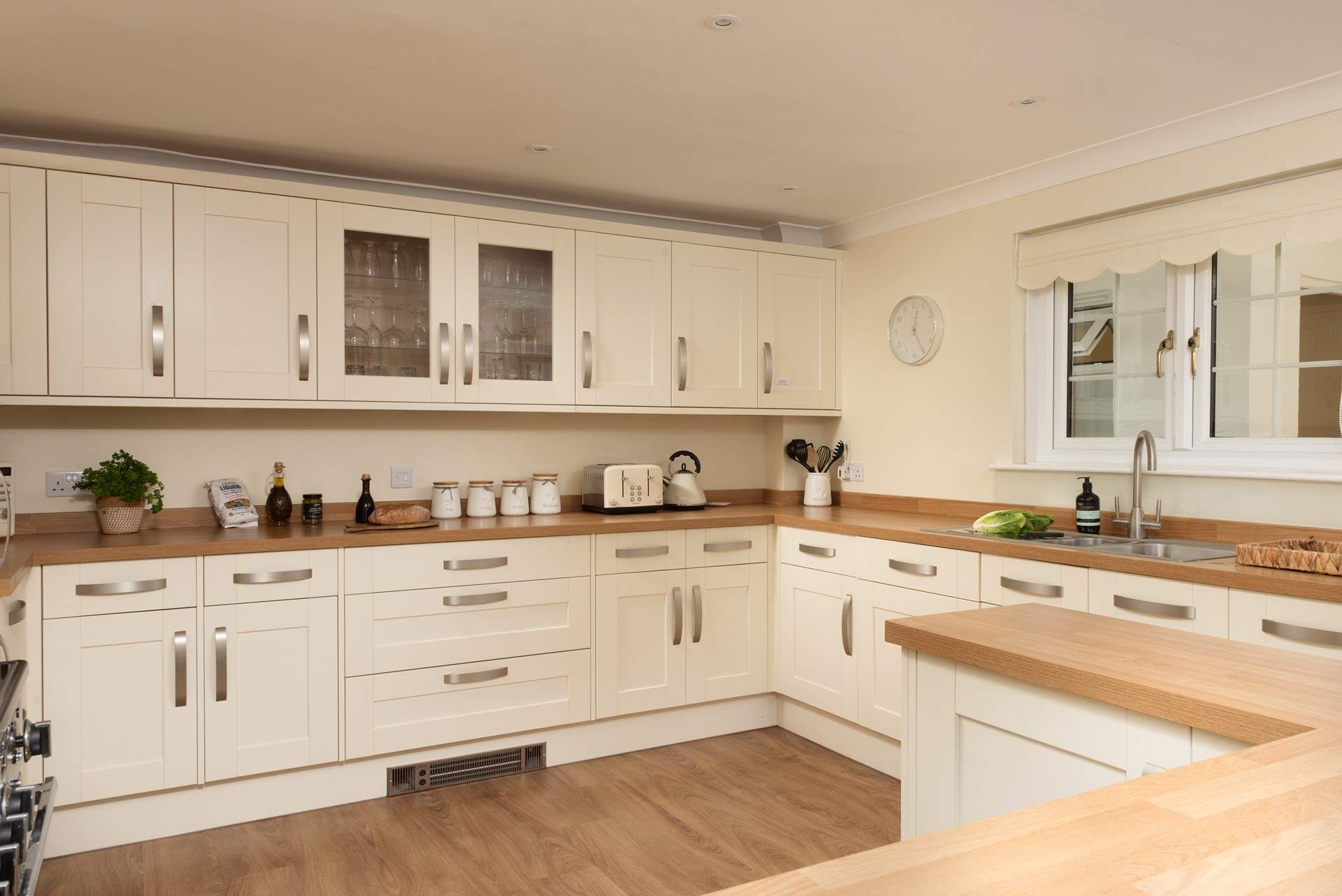 The light and airy kitchen is well-equipped for your every need. 