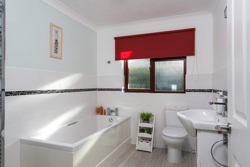 The light and airy family bathroom is located on the ground floor.