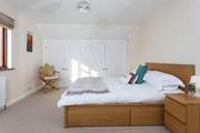 The master bedroom is an oasis of calm with a very comfortable bed.