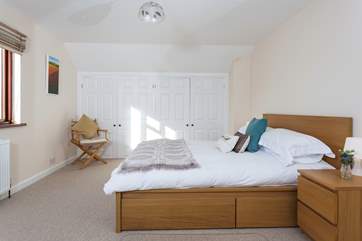The master bedroom is an oasis of calm with a very comfortable bed.
