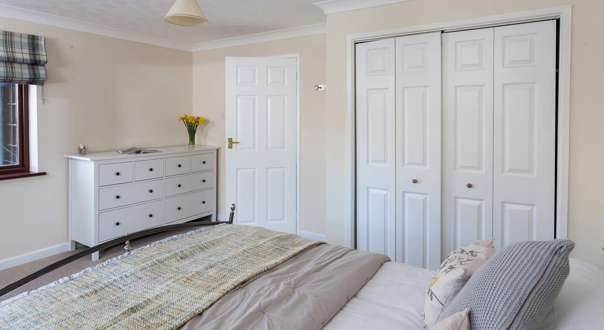 The ground floor double bedroom is styled in lovely linens.