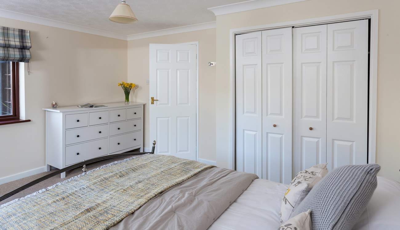 The ground floor double bedroom is styled in lovely linens.