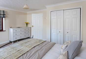 The ground floor double bedroom is styled in lovely linens.