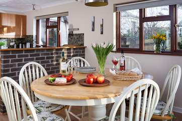 The light and airy kitchen/dining-room is a true home from home.