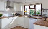 A kitchen with a garden view. - Thumbnail Image