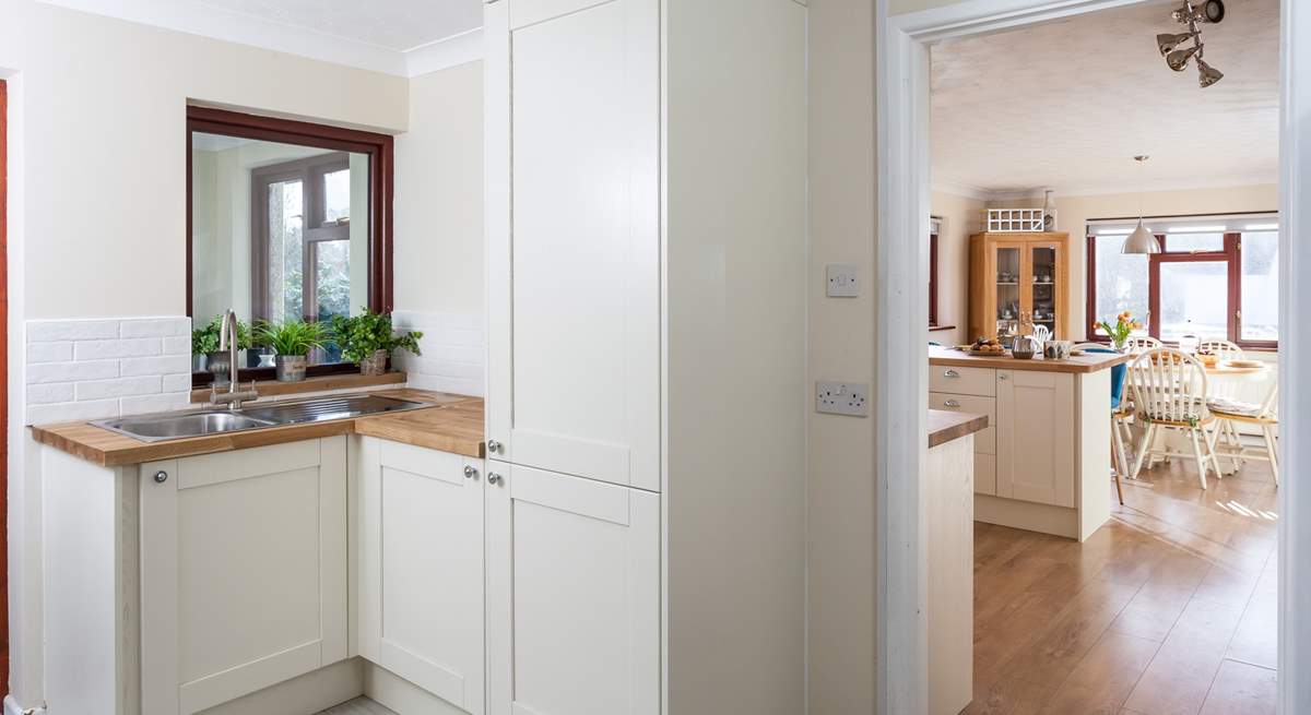 The handy utility-room leads into the kitchen.