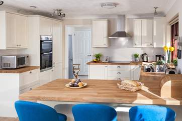 The gorgeous kitchen is very well-equipped.