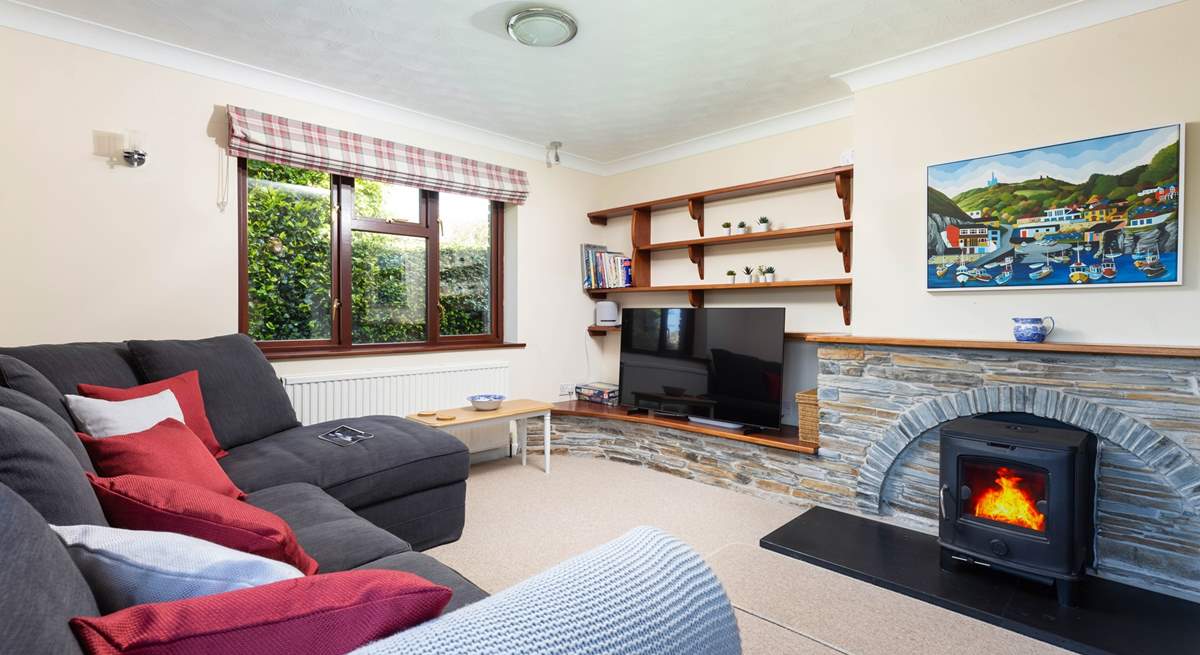 Trefechan has a wonderful cosy sitting-room with patio doors out to the terrace and garden. (Please note, the wood-burner is ornamental).