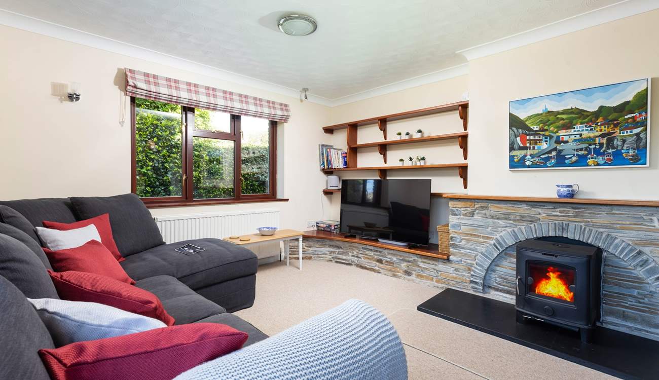 Trefechan has a wonderful cosy sitting-room with patio doors out to the terrace and garden. (Please note, the wood-burner is ornamental).