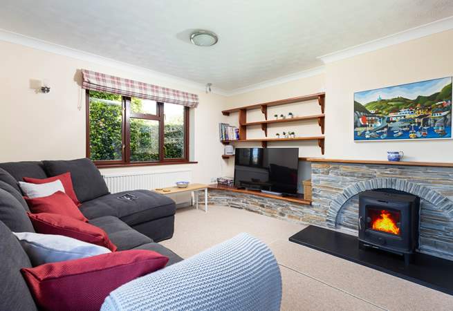 Trefechan has a wonderful cosy sitting-room with patio doors out to the terrace and garden. (Please note, the wood-burner is ornamental).