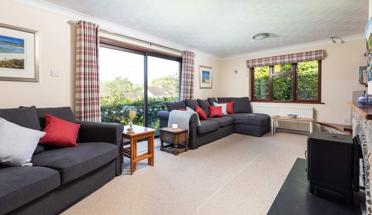 The cosy sitting-room has two sofas.