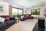 The cosy sitting-room has two sofas.