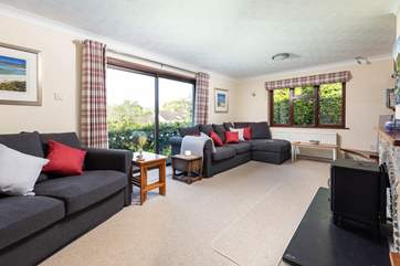 The cosy sitting-room has two sofas.