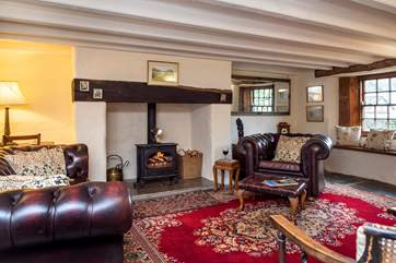 Snuggle up in front of the cosy wood-burning stove.