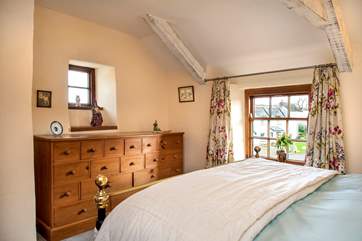 Bedroom 2 has a pretty bedstead.