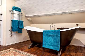 The main bathroom has a fabulous double-ended free-standing bath.