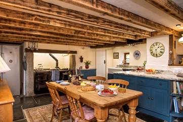 Exposed beams, slate floors, granite posts and that all-important Aga make this the perfect country kitchen.
