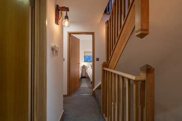 The first floor landing connects both floors and is home to the bedrooms and bathrooms.