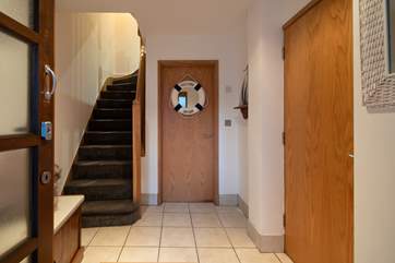 Step into this fabulous space. Perfect for kicking your shoes off and dumping your bags before heading up into the main house.