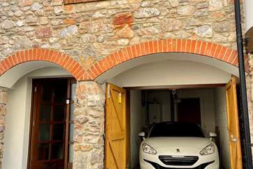 The garage is a snug fit for small to medium-sized vehicles.
