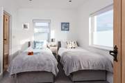 The twin bedroom on the ground floor has an en suite shower-room.