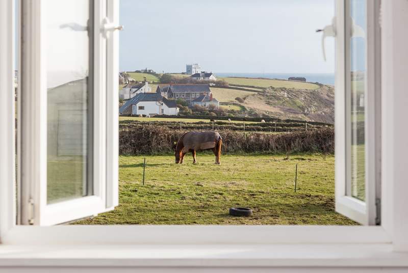 The master bedroom boasts views over both Kynance Cove and Lizard Point. 