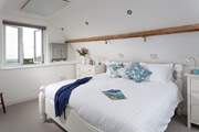 The main bedroom on the first floor has a luxurious super-king bed but feels very cosy with the sloped ceilings (Bedroom 3).