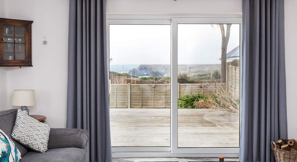 The sitting-room has French windows that open up to a large deck, perfect for those warmer months. 