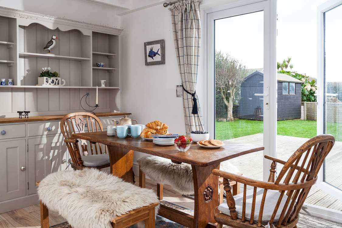 The dining-area has floor to ceiling double doors that open to the decking and garden.