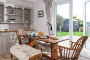 The dining-area has floor to ceiling double doors that open to the decking and garden.