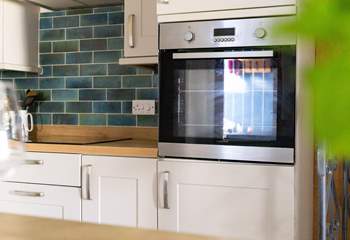 The kitchen has plenty of work space for either cooking your evening meal or unwrapping your fish and chips. 