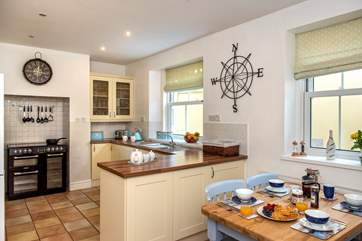 The kitchen is well-equipped and there's also a useful utility-room.