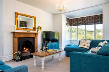The cosy sitting-room has an open fire, ideal for those out-of-season breaks.
