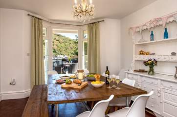 The dining-room has patio doors leading out to the decking-area.