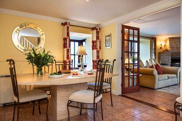 The dining-room sits between the kitchen and the sitting-room.