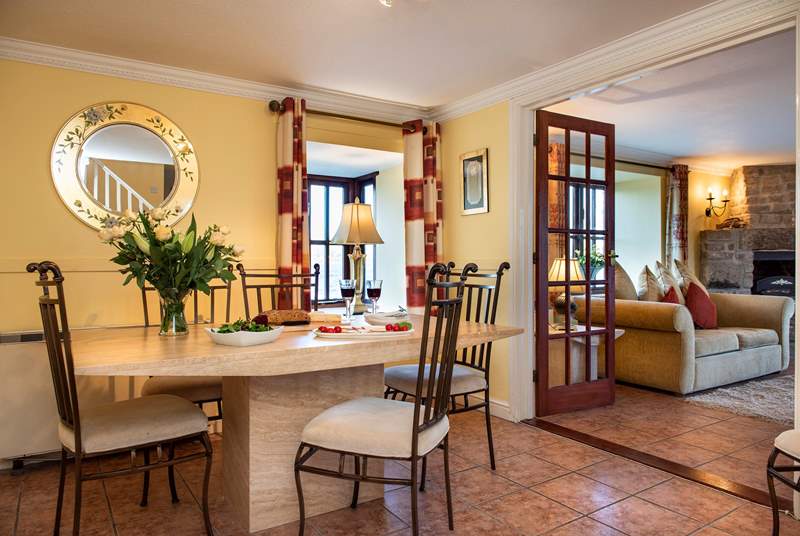 The dining-room sits between the kitchen and the sitting-room.